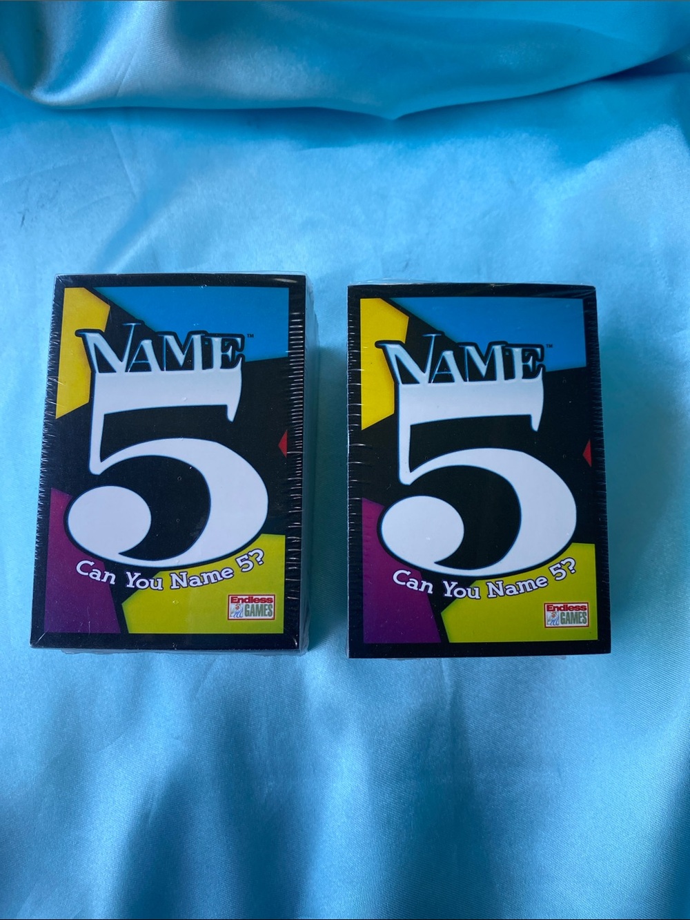Two sealed decks of Name 5 game cards